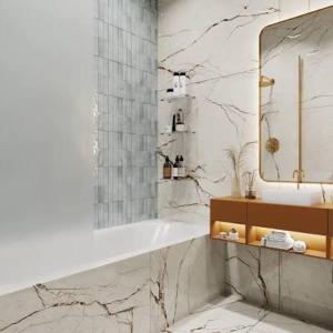 a bathroom with a sink and a mirror and a tub at Madigul in Andijan
