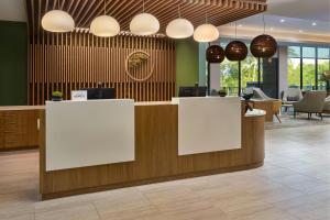 a lobby with white reception desks and chairs at Element by Marriott Bainbridge Riverfront in Bainbridge +44 photos