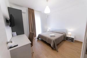 Llit o llits en una habitació de Makasa