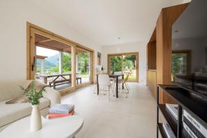 a living room with a couch and a table at Perla di Mergozzo 2 in Mergozzo