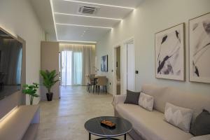 a living room with a couch and a table at Argiri Apartments & Suites in Georgioupolis