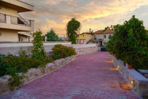 a brick walkway in front of a building at ÖzkanHouse in Ürgüp