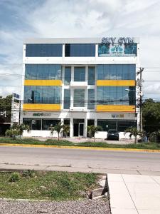 a building with a car parked in front of it at EdificioSsur 0601 in Choluteca