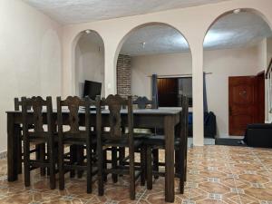 a dining room with a table and chairs at Casa Cariño in San Cristóbal de Las Casas