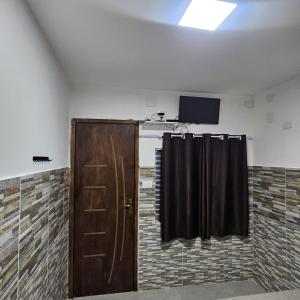 a room with two black curtains and a door at Hotel Rei in São Bernardo do Campo +38 photos