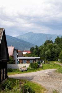a view of a house with mountains in the background at Privat Kovacova in Žiar