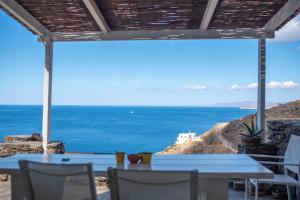 a patio with a view of the ocean at Off the beaten path! Maisonette & Pool in Kithnos