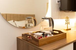 a room with a mirror and a blender on a table at ZANI'S VILLA in Vlorë +175 photos