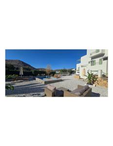 arial view of a building with a resort at Syros Blue Lagoon G2 in Galissas +5 photos