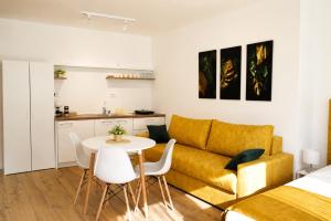 a living room with a couch and a table at Vila Lago Verde in Zvornik