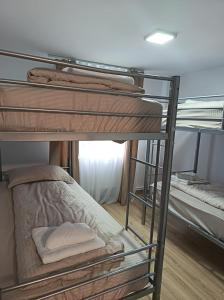 a group of bunk beds in a room at Cabana Tonea in Avrig +32 photos
