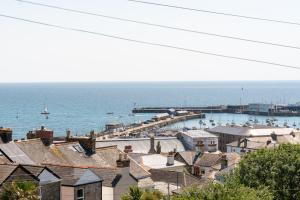 a view of a harbor with boats in the water at Modern Studio Apartment with harbour views in Penzance