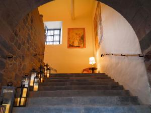 a stairway leading up to a building with a window at Novotel Cusco in Cusco