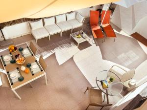 an overhead view of a living room with a couch and a table at Central Olhão Home - Private Spacious Sunlit Patio in Olhão
