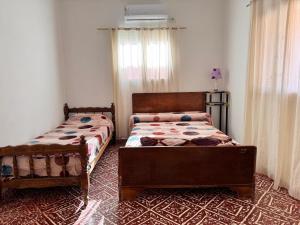 a bedroom with two beds in a room at Don Luis Alberto in El Puesto +5 photos