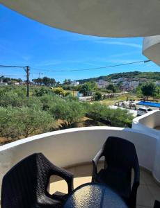 a chair sitting on a balcony with a view at Casa Lu in Ulcinj