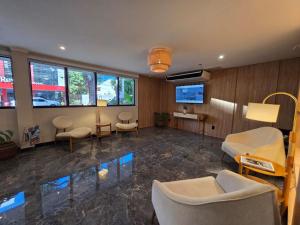a hospital room with chairs and a waiting area at Village Iguassu Hotel in Foz do Iguaçu