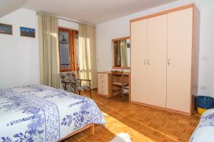 Кровать или кровати в номере Apartments and Rooms Tajcr