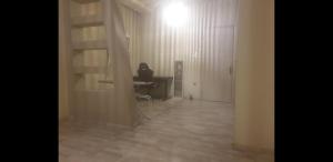 a room with a desk and a table and a light at O&M Port Piraeus in Piraeus