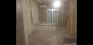 a hallway with a bed in a room at O&M Port Piraeus in Piraeus