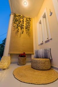 a room with a window with a pillow and a rug at Μπλε Rooms & Apartments in Chiliadou