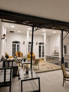 a large living room with tables and chairs at Sheki Panorama Garden in Sheki