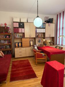 a living room with a table and a dining room at Villa Pazelt Top1 in Bad Vöslau