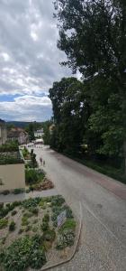 an empty street with people walking down the road at Apartament 5- Bliżej Zdroju in Polanica-Zdrój
