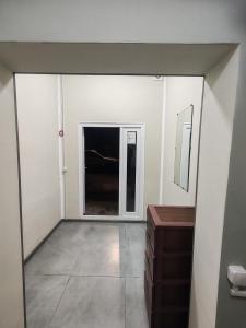 an empty room with a window and a dresser at MG guest house in Geghanist