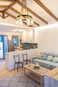 a living room with a couch and a table at Paul's Horizon in Chios