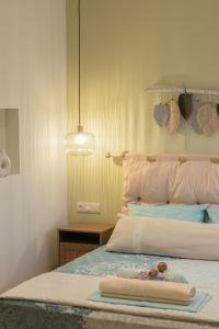 a bedroom with a bed with a towel on it at Paul's Horizon in Chios