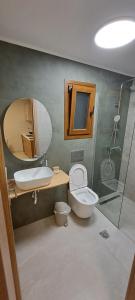 a bathroom with a sink and a toilet and a shower at Calm And Nature in Petra