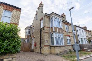 an old brick house with a fence in front of it at Clare - Double Room 20 mins walk to centre -Kitchenette Smart TV Shared bathroom in Chesterton
