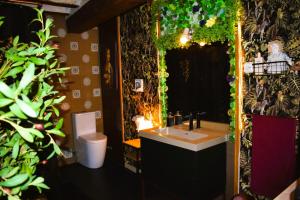 a bathroom with a sink and a toilet at Casa Rural Julio in Terriente +51 photos