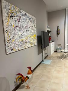 a living room with a large painting on the wall at B&B La Tenuta in Fermo