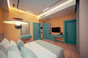 a bedroom with a bed and a television in it at Qachaquch Forest in Qusar +51 photos