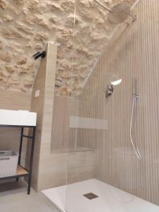 a bathroom with a shower with a glass door at Il Rifugio del Re in Manfredonia