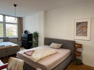 a bedroom with a bed in a room at Conscious Stay - Mindful Living in Berlin