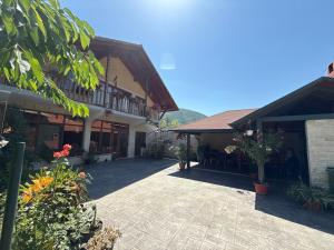 a courtyard of a building with flowers and plants at Belareca Garden in Mehadia