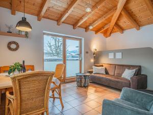 a living room with a couch and a table at IndieBerge in Mittersill +16 photos