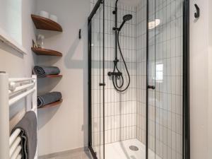 a shower with a glass door in a bathroom at MAYR 74 in Wörgl +35 photos