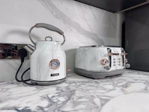 two toasters sitting on top of a counter at Sunderland Central 2BR Apartments in Sunderland