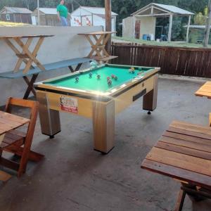 a pool table with balls in it on a patio at Regional Park in Rafard