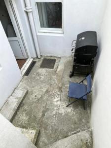 a room with a desk and a chair next to a door at St Leonards in Hollington
