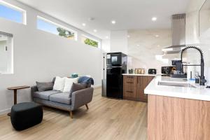 a kitchen with a couch and a sink and a refrigerator at Spacious 1BR 1bath near DTLA in Los Angeles