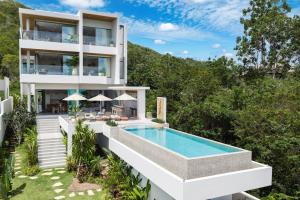 an aerial view of a house with a swimming pool at Mee Kham Sook Luxury Villa in Nathon Bay