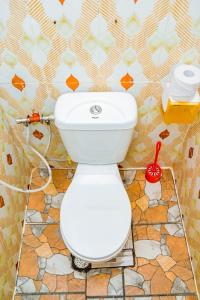 a bathroom with a white toilet in a room at The new home in Moshi +39 photos