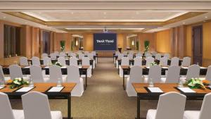 a conference room with tables and white chairs at Dusit Thani Laguna Phuket in Bang Tao Beach +226 photos