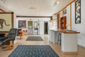 a room with a kitchen and a living room at 6048-Stege-Kostervej-48 in Stege