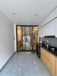a kitchen with a sink and a dishwasher at ALUC 2 HOUSE CatBa in Cat Ba